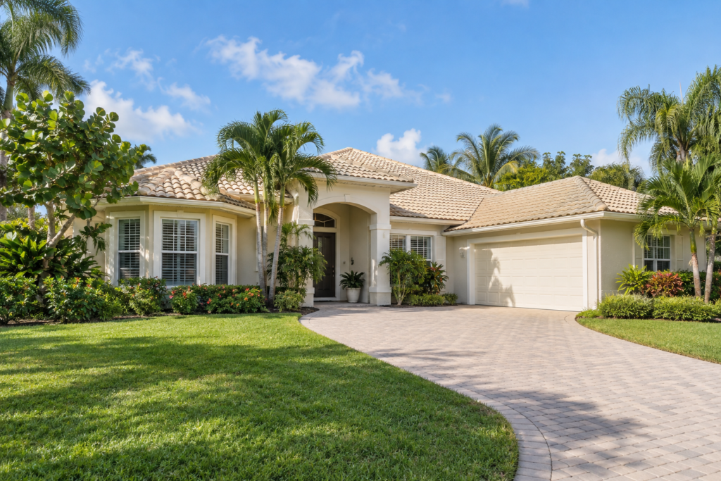 Illustration of a South Florida-style home with a tile roof and tropical landscaping